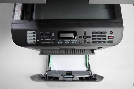 A multi function printer, copier, scanner on office table. top view