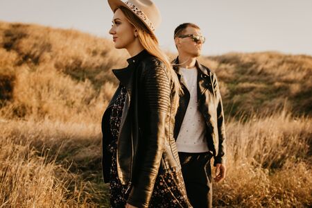 Happy young couple enjoying outdoors during sunset - Imageの写真素材