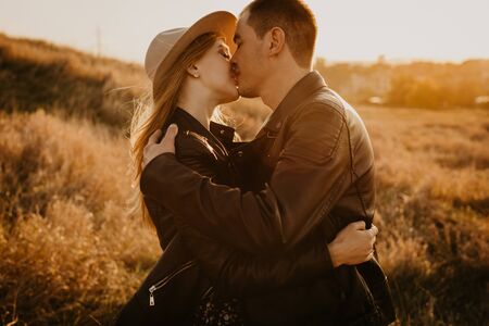 Happy young couple enjoying outdoors during sunset - Image の写真素材