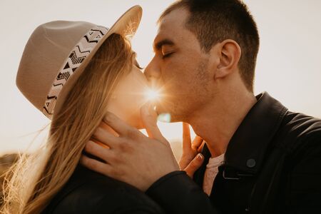 Happy young couple enjoying outdoors during sunset - Imageの写真素材