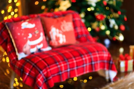 Christmas home room with tree and festive bokeh lighting, blurred holiday backgroundの写真素材