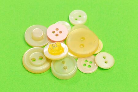 collection of vintage cloth button on colored background 
