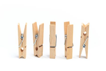 Brown wood clothes peg or clothespin on white background.