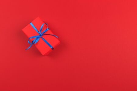 Gift box with ribbon and bow on color background and space for text. Top viewの写真素材