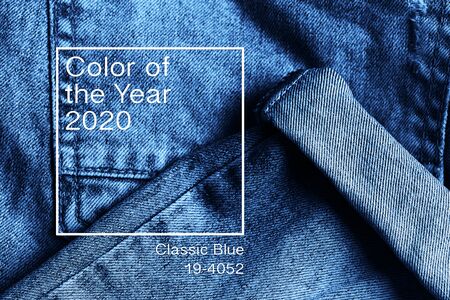 Top view minimalistic background. Denim jeans texture .  Web banner, greeting card idea. Concept color of Year 2020の写真素材