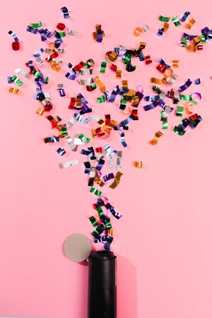 Colour sparkles on pink holiday background. Festive backdrop for your projects.の写真素材