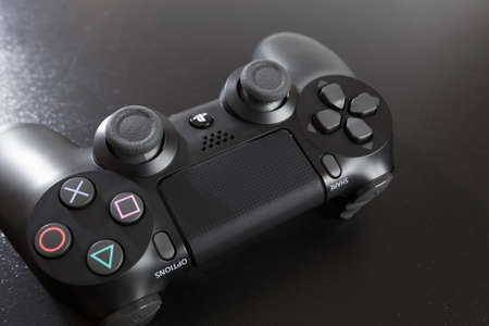 Russia, OKTOBER 24 2019: The new Sony Dualshock 4 with PlayStation 4. Sony PlayStation 4 game...
