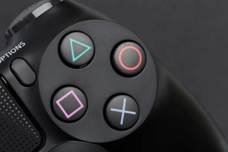Russia, OKTOBER 24 2019: The new Sony Dualshock 4 with PlayStation 4. Sony PlayStation 4 game...