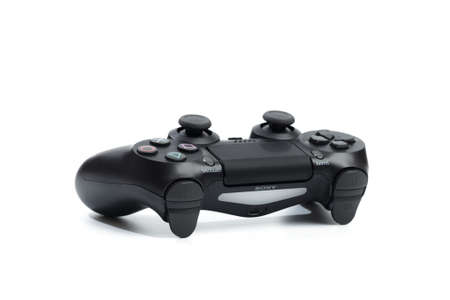 Russia, OKTOBER 24 2019: The new Sony Dualshock 4 with PlayStation 4. Sony PlayStation 4 game...