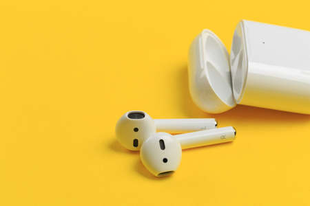 Apple AirPods - wireless bluetooth earphones or headphones and white box for storage and charging, use with Iphone, Ipad or Macのeditorial素材
