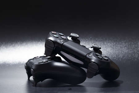 Russia, OKTOBER 24 2019: game joystick. playstation. on a blue background top view. The new Sony...