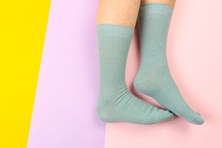 legs in colorful socks on colorful  backgroundの写真素材