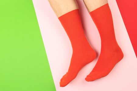 legs in colorful socks on colorful  backgroundの写真素材
