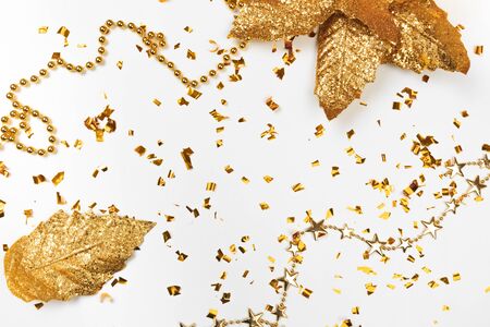 Golden stylish decoration on white  background. Place for text. Festive concept.の写真素材
