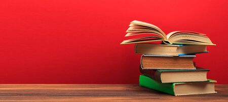 Opened Book on a pile of old books, panorma, good copy space -Imageの写真素材