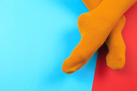 legs in colorful socks on colorful  backgroundの写真素材