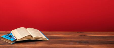 Opened Book on a pile of old books, panorma, good copy space -Imageの写真素材