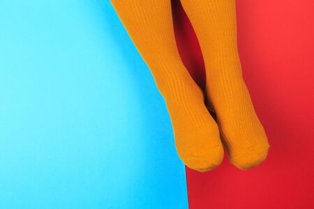 legs in colorful socks on colorful  backgroundの写真素材