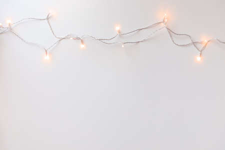 garland of lights on a light background top viewの写真素材