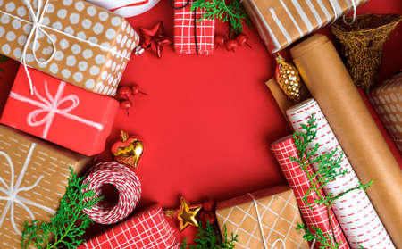 new year gifts and decorations on red background top view- Imageの写真素材