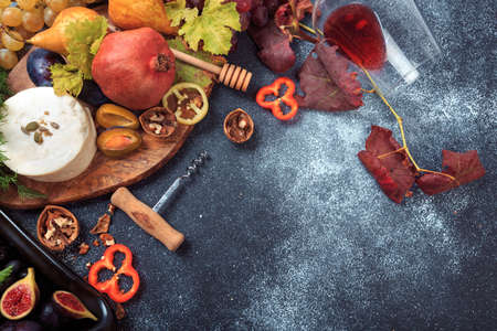 Mediterranean snacks - grapes, olives, bread, fruit, seedsの写真素材
