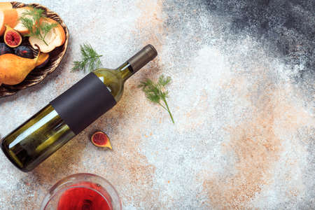 bottle with wine and snacksの写真素材