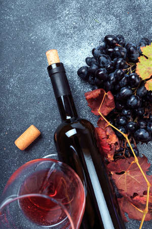bottle with wine and grapeの写真素材