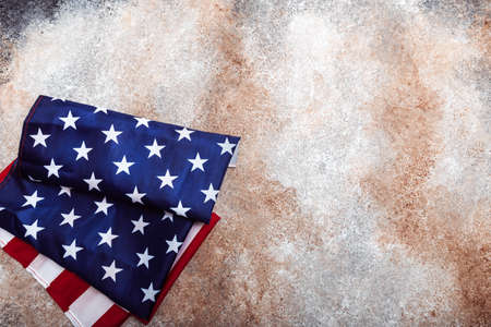 American rolled flag on grunge backgroundの写真素材