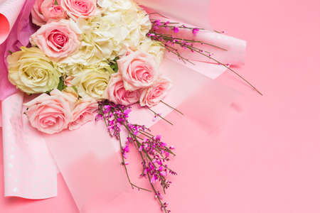 bouquet of flowers on pink background