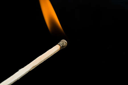 burning match on black backgroundの写真素材