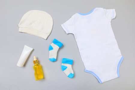 Baby concept. Baby cloth and goods on grey  background. Place for text. View from above. Flat Layの写真素材