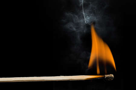burning match on black backgroundの写真素材