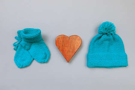 Baby concept. knitted things for the baby handmade on grey  background. Place for text. View from above. Flat Layの写真素材