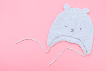 Baby bonnet on pastel pink background - Imageの写真素材