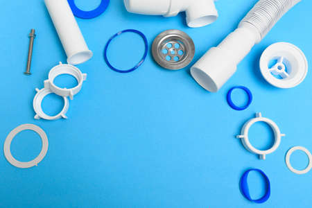 Details siphon kitchen sink on blue  backgroundの写真素材