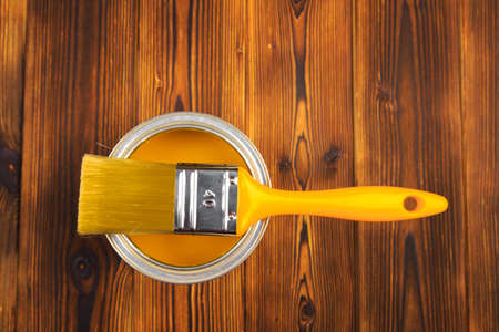 House renovation, paint can on the old wooden background with copy spaceの写真素材