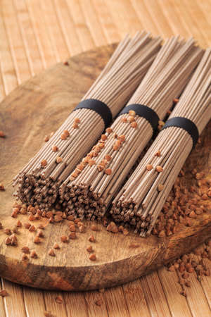 Buckwheat noodles closeup. Raw food ingredient. Dried buckwheat soba noodles. Traditional Japanese foodの写真素材