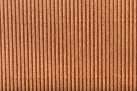 corrugated cardboard for packing. abstract background horizontal lines with wavy lines of beige colorの写真素材