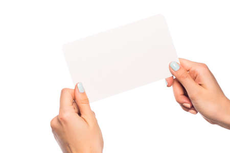 female hand isolated on white background holding card  with text placeの写真素材