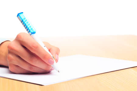 female hands write in a notebook . Office place