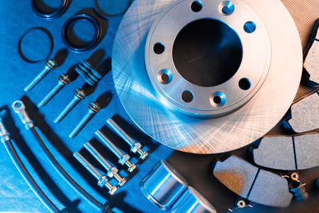 brake parts on dark background  brake pads, disc, brake hose, guides, cylindersの写真素材