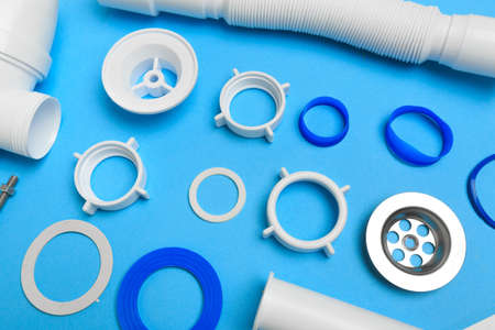 Details siphon kitchen sink on blue  backgroundの写真素材