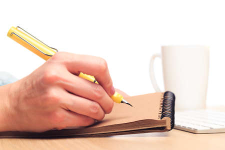 female hands write in a notebook . Office placeの写真素材