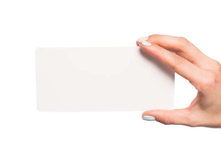 female hand isolated on white background holding card  with text placeの写真素材