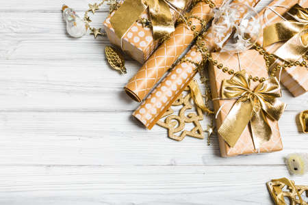 golden christmas decorations on white background. Flat lay, top view, copy spaceの写真素材