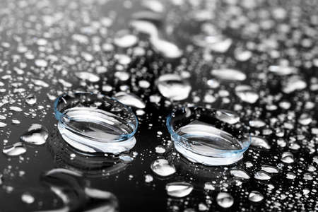 contact lenses on dark background close up viewの写真素材