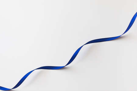 loops of blue ribbon on gray text place - Imageの写真素材