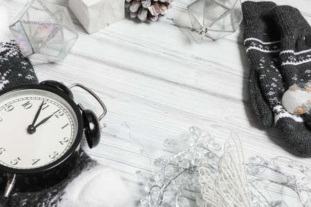 silver christmas decorations and notebook on white background. Flat lay, top view, copy space