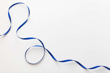 loops of blue ribbon on gray text place - Imageの写真素材