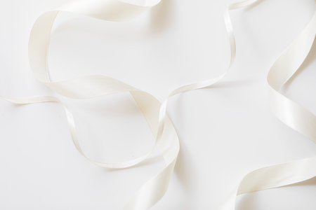 loops of white ribbon on gray text place - Imageの写真素材